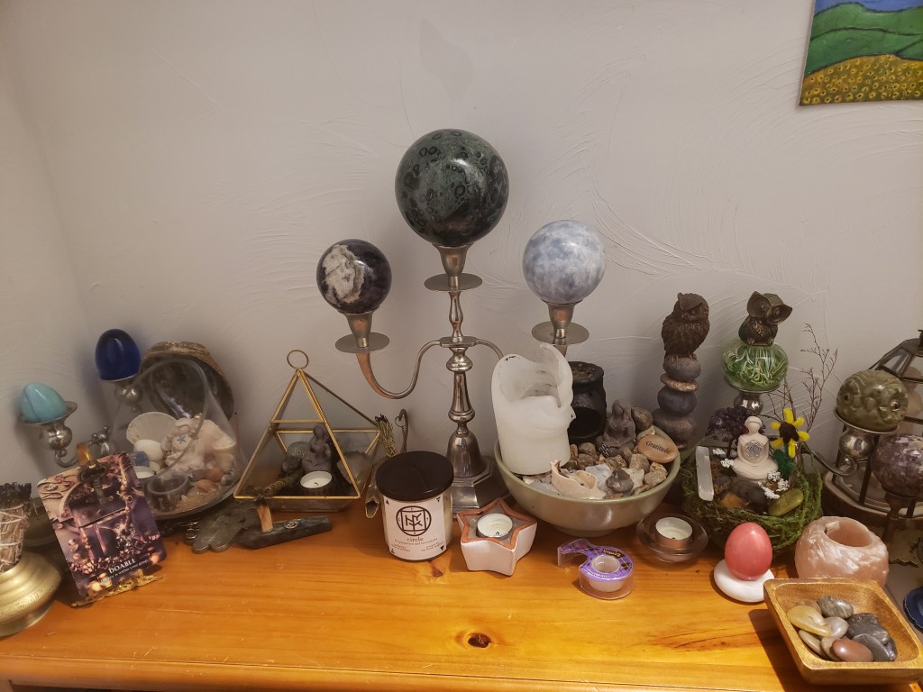 Witch altar located in a closet filled with witcy decor, witch tools, and a lovely witch aesthetic